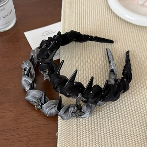 Detail of elegant mesh fabric headbands with sparkling star accents and inner comb teeth