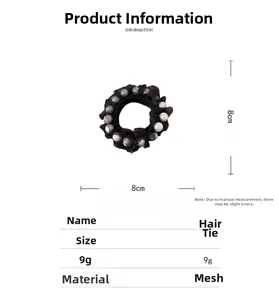 Detail view showing black mesh hair scrunchie with pearls and 8cm diameter size spec