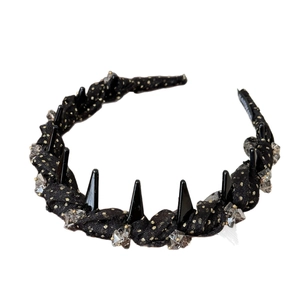 Gold polka dot mesh headband with black spikes and crystals for elegant hairstyle