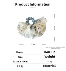 Floral print fabric scrunchie with layered ruffles, measuring 23cm by 17cm and 21.5g