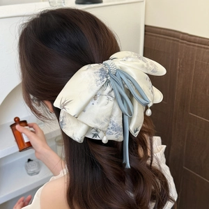 Elegant large ribbon bow hair clip with bamboo print and faux pearls for women