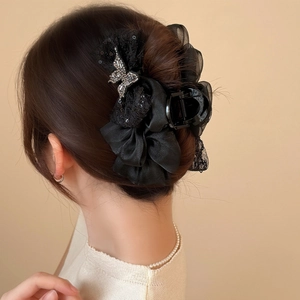 Elegant black organza flower hair claw clip with silver rhinestone butterfly detail