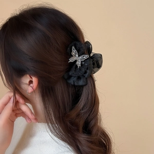 Elegant black tulle hair claw clip with a sparkling silver rhinestone butterfly design