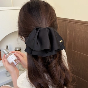 Elegant large black satin double-layered bow hair clip with gold metal emblem for women