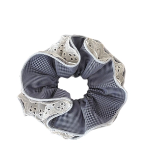 Blue plaid scrunchie with cream lace trim for ponytail styling in vintage style