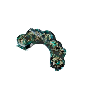 Pince à cheveux élégante vert émeraude avec motifs floraux dorés et strass brillants