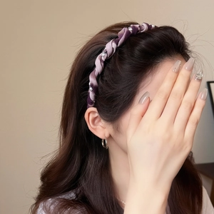 Elegant purple twisted satin headband with white pearls for a sophisticated summer hair style