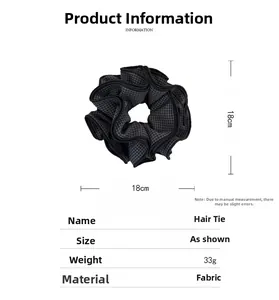 Detail view of 18cm large black and gray checkered fabric scrunchie with dimensions and weight