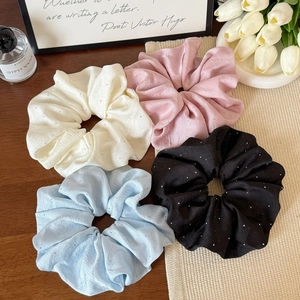 Set of four satin scrunchies with sparkling rhinestones in white, pink, blue and black