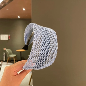 Light blue woven headband featuring a Bohemian hollow lattice design and non-slip ends