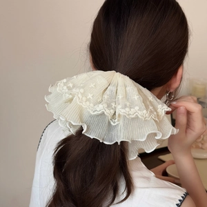Cream white oversized lace scrunchie with floral embroidery for low ponytail styling
