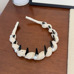 Detailed view of cream lace pleated headband with elegant pearls and non-slip teeth