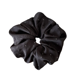 Elegant black pleated scrunchie with sparkling silver rhinestones for stylish hair styling