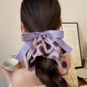 Elegant purple satin ink-wash hair scrunchie with long ribbons for ponytail styling
