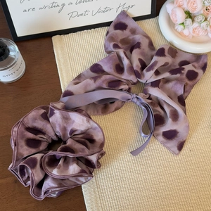 Elegant purple leopard print scrunchie set including a large hair tie and ribbon bow