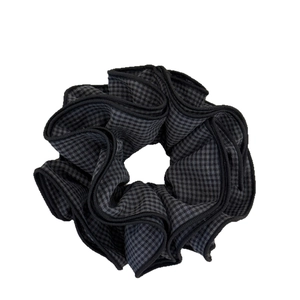 Elegant four-layer black and grey gingham scrunchie with detailed stitching and soft fabric