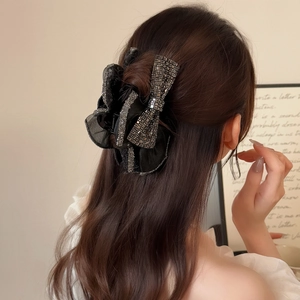 Elegant large black mesh bow hair claw clip with rhinestones for voluminous hairstyles
