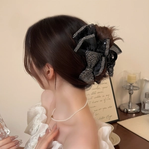 Elegant large black bow hair claw clip with shimmering rhinestones for thick hair