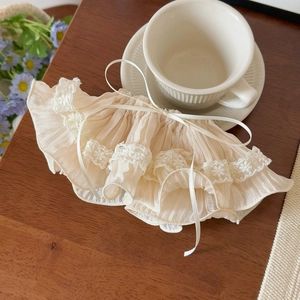 Detailed view of cream lace hair clip with chiffon texture and delicate ribbon bow