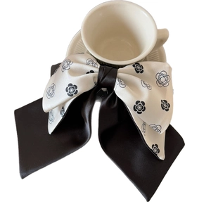 Elegant white camellia ribbon hair claw clip with long black satin bow for women