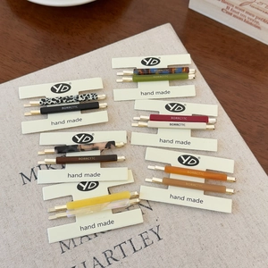 Set of 6 minimalist acetate hair clips in assorted leopard and solid colors on display