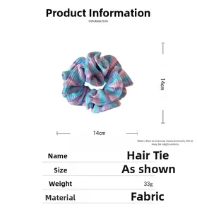 Detail view of colorful ribbed fabric scrunchie with 14cm diameter and rainbow stripes