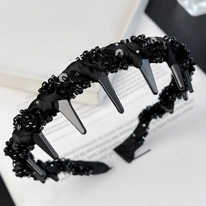 Detailed view of black beaded headband with built-in styling combs and sparkling sequins