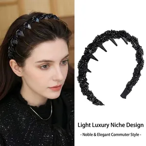 Elegant black beaded headband with spiked details and non-slip comb for hair volume