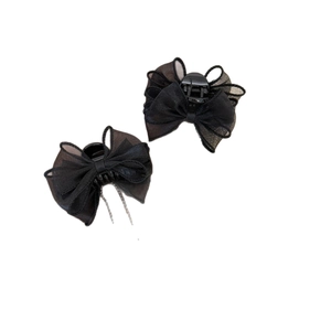 Elegant black tulle bow hair claw clip with silver chain tassels on white background