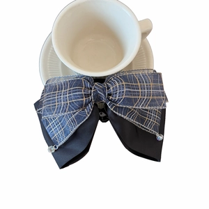 Elegant plaid bow hair clip with blue and gold patterns and crystal beads on white background