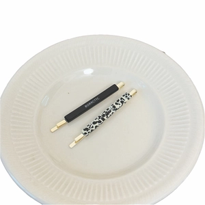 Retro acetate hair clip set with black lettered bar and stylish leopard print pattern