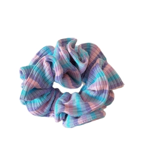 Colorful striped knit scrunchie with purple blue and pink ribbed texture hair tie