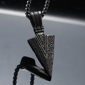 Vintage stainless steel spearhead pendant with dotted texture and black metal finish