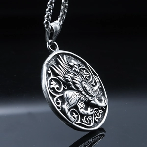 Vintage stainless steel round pendant necklace featuring mythological beast relief