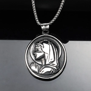 Detailed view of Saint Mary oval embossed pendant on a vintage steel Venetian chain