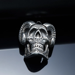 Gothic stainless steel ram skull pendant with horns on reflective black background