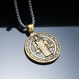 Vintage gold Saint Benedict medal pendant with silver stainless steel box chain on black