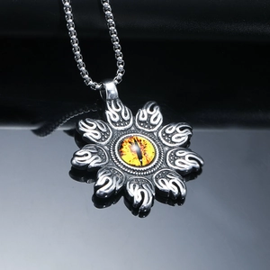 Retro stainless steel flame pendant with yellow dragon eye on a black mirror background