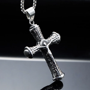 Vintage stainless steel cross necklace with intricate floral engravings and black gems