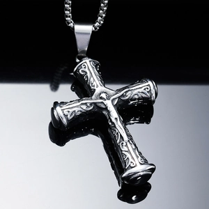 Vintage steel cross pendant necklace with intricate engravings and black gemstone accents