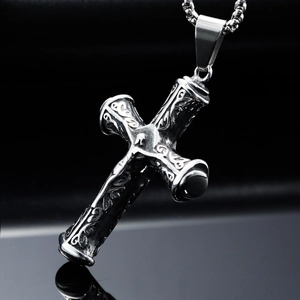 Vintage stainless steel cross necklace with intricate mythological carvings and Gothic style