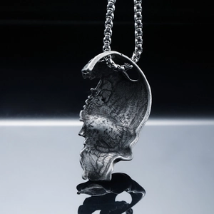 Gothic style half-skull titanium steel pendant with aged finish and ball chain necklace