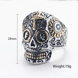 Gothic skull ring in silver and gold steel with cross engraving and floral details