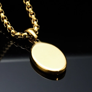 Minimalist gold tone stainless steel necklace with polished oval moon star pendant design