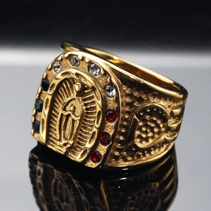 Gold-plated religious ring with Virgin Mary carving and multicolored crystals on horseshoe
