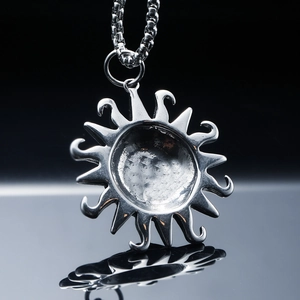 Punk style stainless steel sun pendant necklace with wavy rays on a dark reflective base