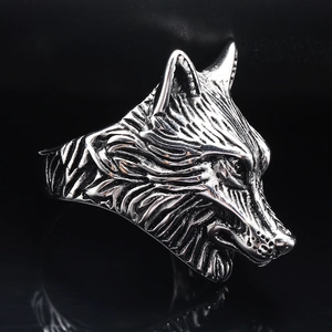 Gothic punk viking wolf head ring made of silver stainless steel on black background