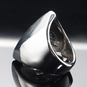 Polished stainless steel wide band ring with a geometric shield cut design