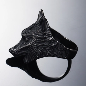 Detailed side view of punk viking wolf head ring with intricate Nordic metal carving texture