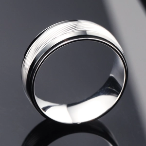 Men's titanium steel ring with diagonal texture, black edges and diamond accent inlay